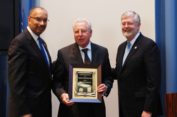 NYSBA President Seymour James (left) and President-Elect David Schraver (right) presenting the NYSBA Pro Bono Award to Touro Law TLC-HEART Volunteer Michael Aronowsky in Albany, NY on May 1, 2013.